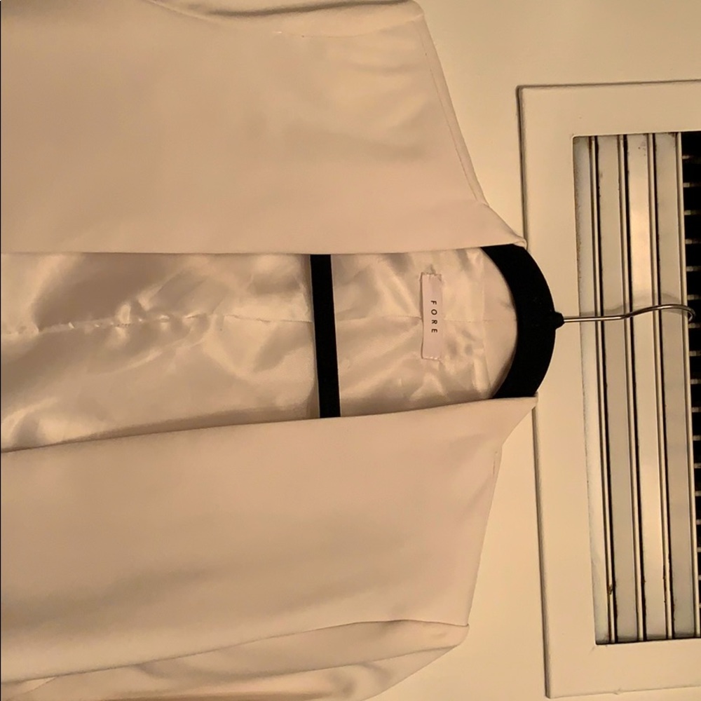 White blazer with accent pockets